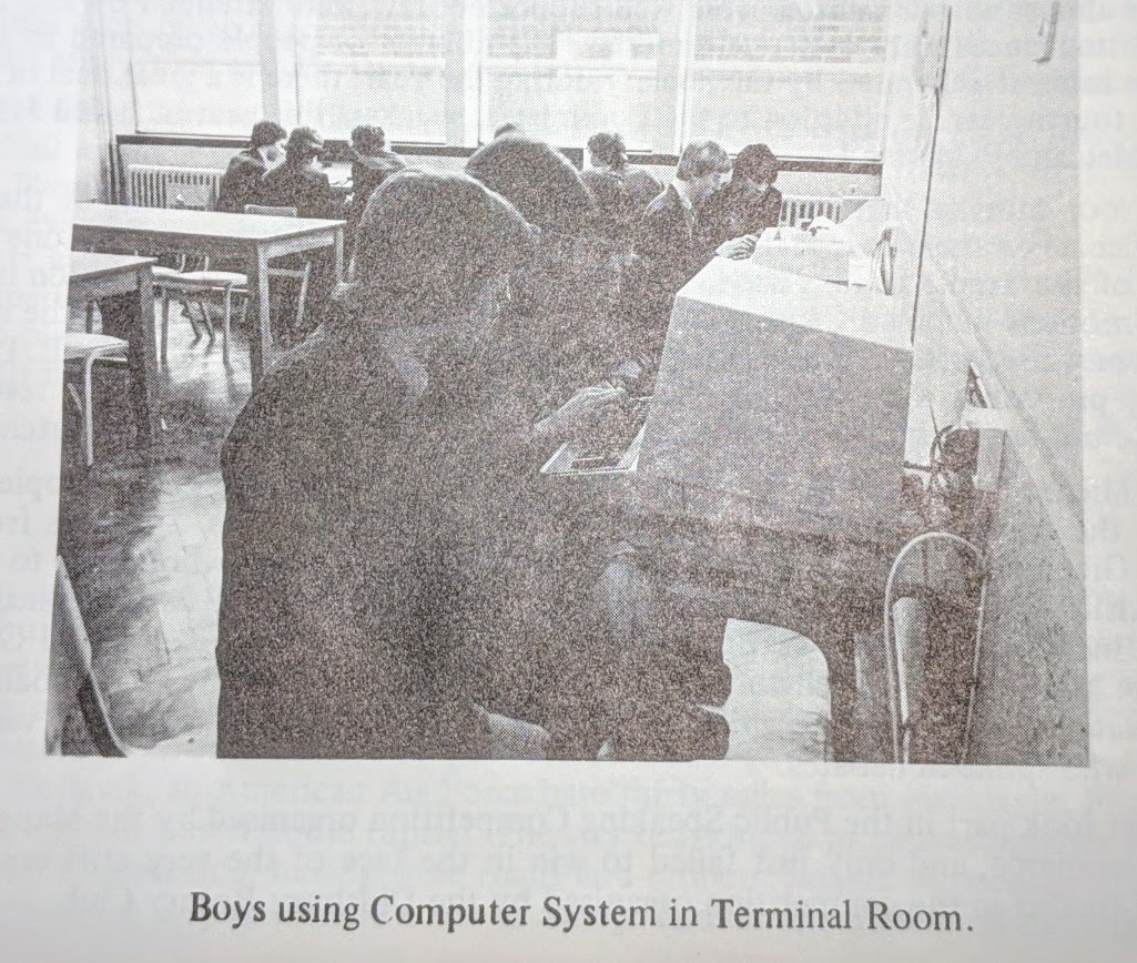 A picture of schoolboys using the terminals of the computer unit